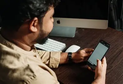 Worker checking phone mid day for leads